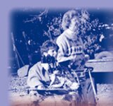 Image of a woman in a wheelchair using an adapted camera.