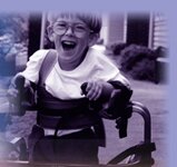 Image of a young boy using a gait trainer.